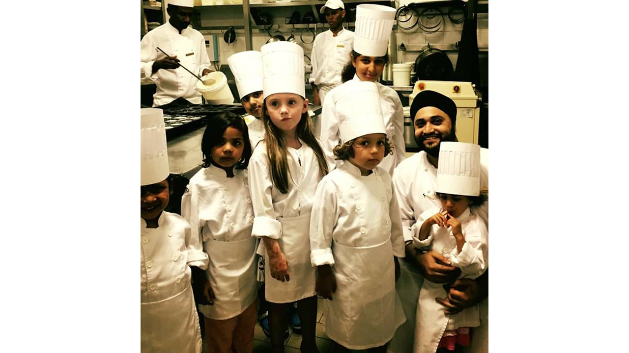 Damanraj with kid chefs.