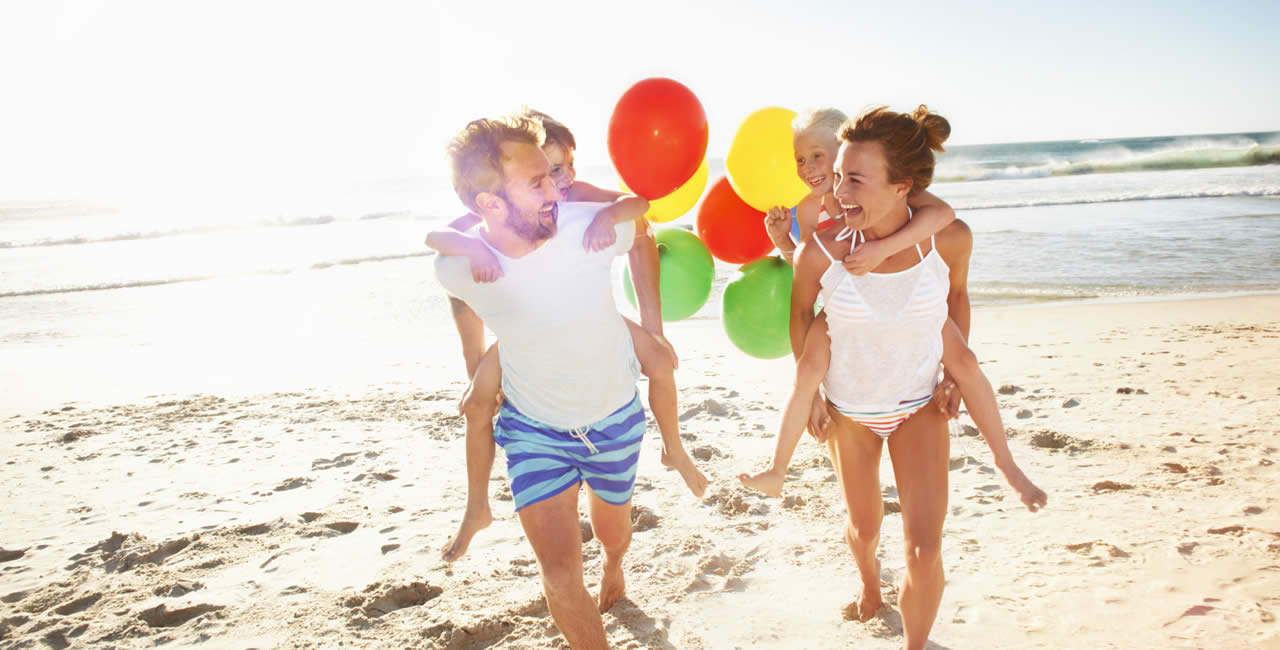 family playing beach